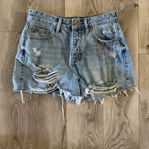 Stylish Distressed Blue Denim Shorts with Chain Detail